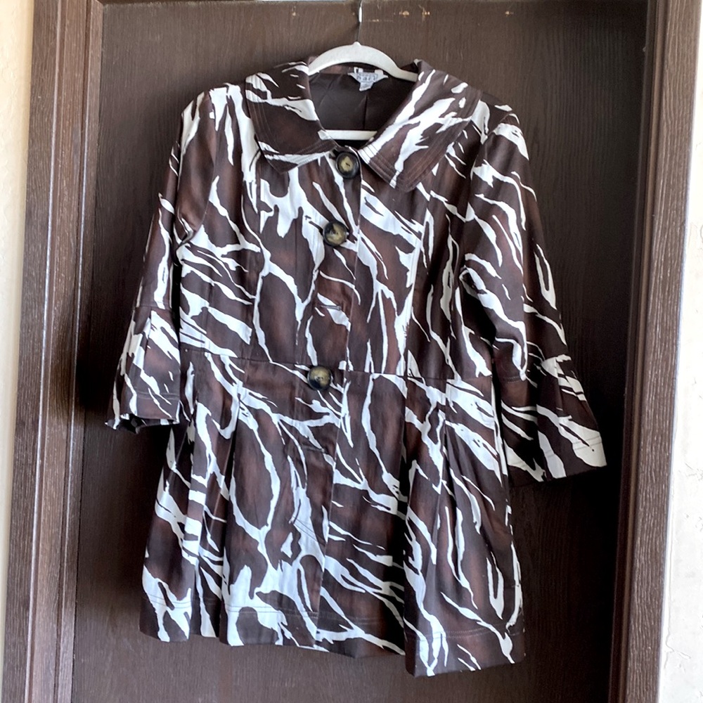 Very cute jacket. Rich brown and white zebra print. Size M .